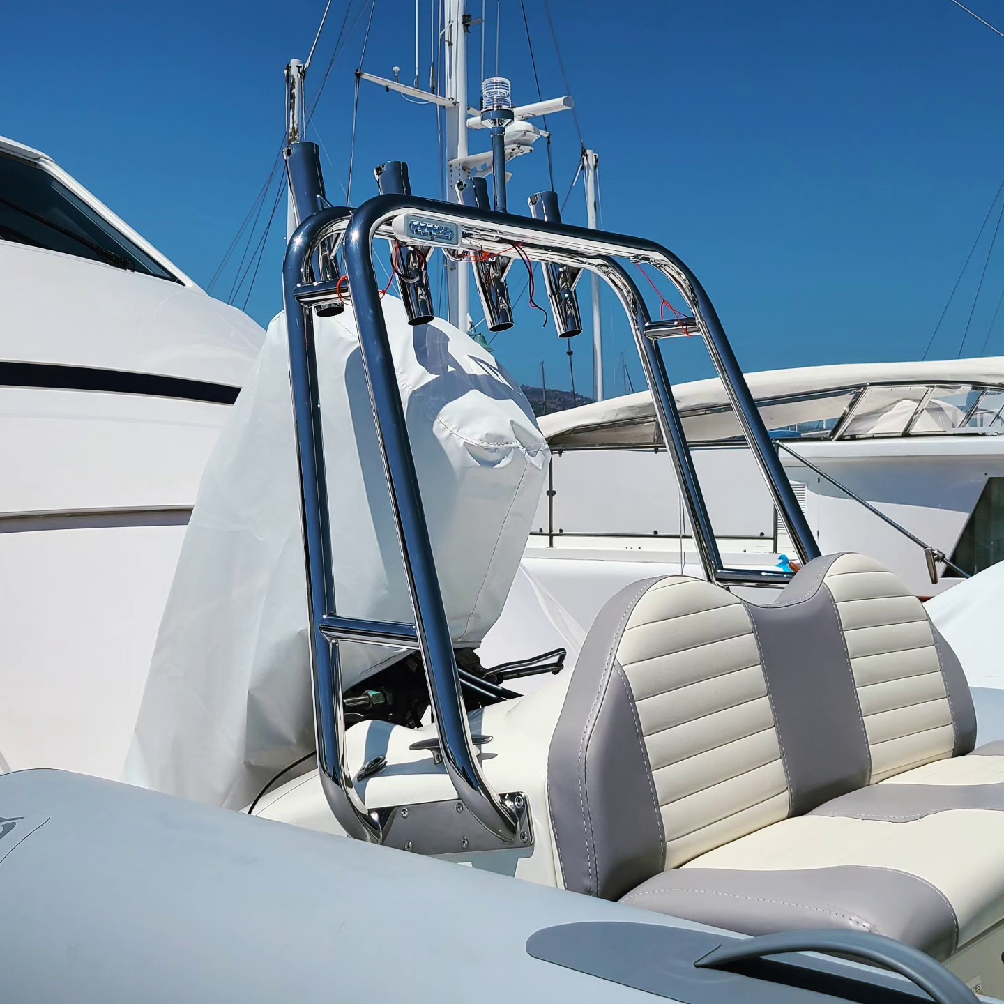 A polished stainless steel railing and tower fabricated for a boat
