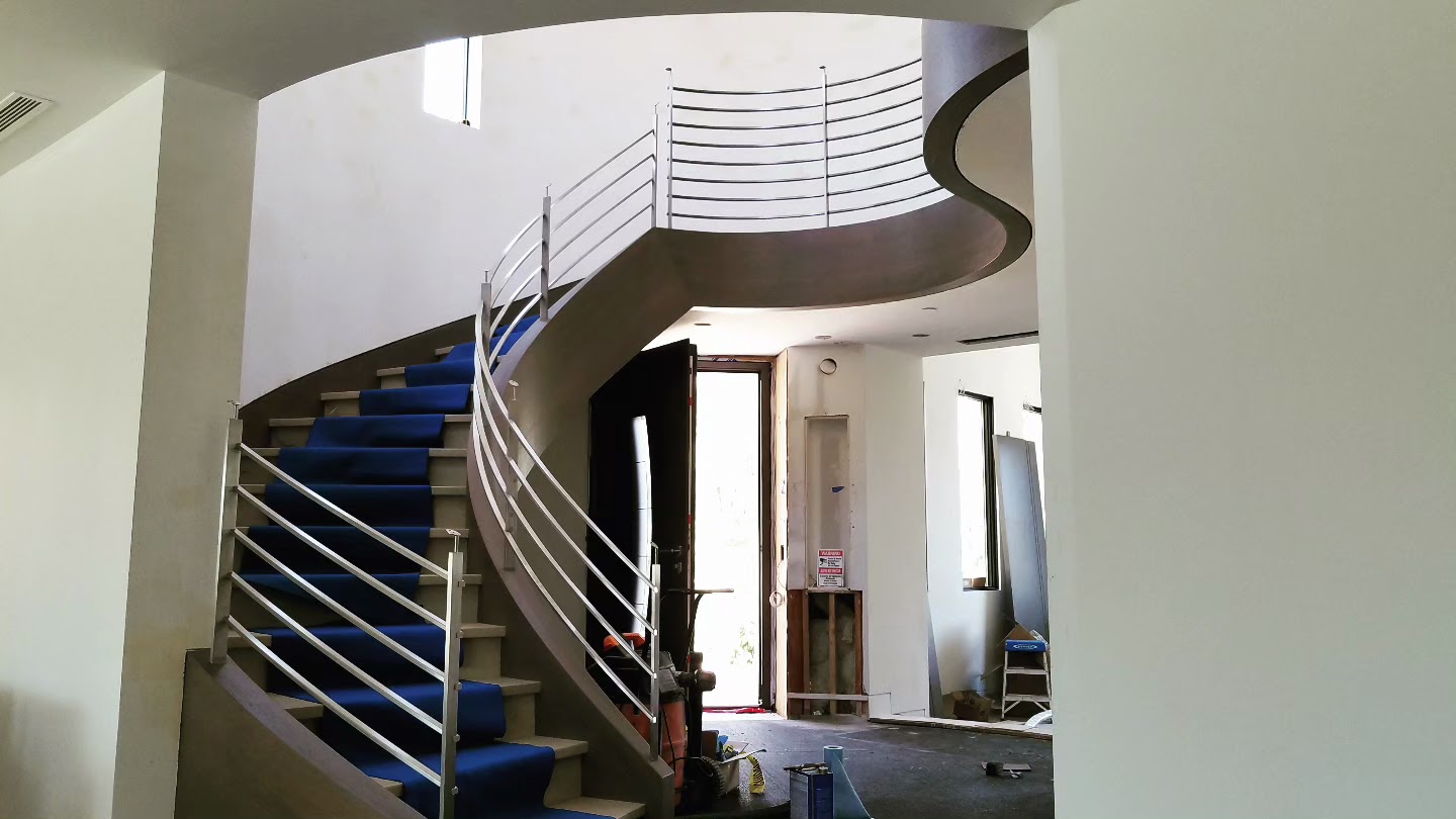 A custom stainless steel staircase railing